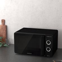 Micro-ondes noir ProClean 3130. 700 W, capacité de 20 L, revêtement Ready2Clean pour un meilleur nettoyage, technologie 3DWave, design de la porte FullCrystal, détails métalliques et 6 niveaux.