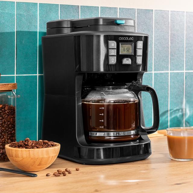 Coffee 66 Grind & Drop Macchina da caffè americano da 12 tazze con rifiniture in acciaio inossidabile e intensificatore di aroma. Cafetière numérique idéale pour remplir 12 tasses avec une finition en acier inoxydable et un intensificateur d’arômes. Digitaler Filterkaffeemaschine für 12 Tassen mit Edelstahl-Finish.