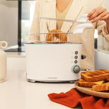 Toast&Taste Double W Tostadora de pan con capacidad para dos tostadas. Incluye pinzas para las tostadas. 650 W de potencia y 7 posiciones de tostado, función descongelar y función recalentar. Sistema de extraelevación, amplia bandeja recogemigas y hueco recogecables.