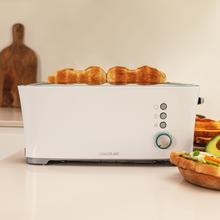 Toast&Taste Extra W Grille-pain avec capacité pour deux tranches de pain. Il dispose d’un support pour les pains de petite taille. 1000 W de puissance et 7 niveaux de grillage ; fonction décongeler et réchauffer. Système d’extra-élévation, ample plateau ramasse-miettes et espace range-câble.
