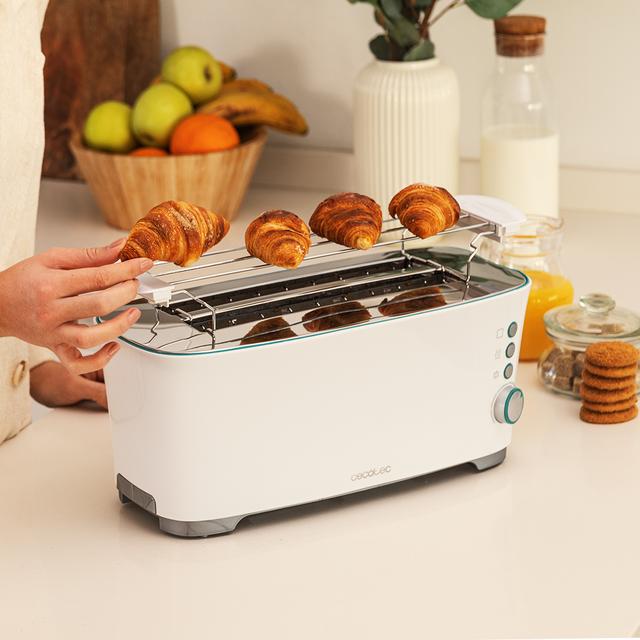 Toast&Taste Extra Double W Grille-pain 2L avec deux fentes, 1350 W de puissance et 7 niveaux de grillage ; fonction décongeler et réchauffer. Système d’extra-élévation, ample plateau ramasse-miettes et espace range-câble.