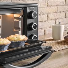 Mini-four Bake&Toast 550. 23 litres de capacité, 1500 W, 3 modes, température jusqu'à 230 °C et double porte en verre.
