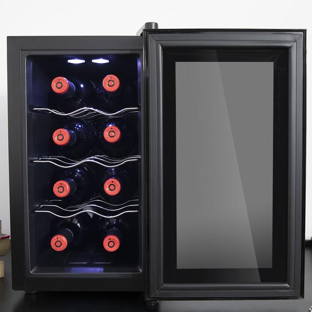 Cave à vin Grand Sommelier 800 CoolCrystal. Cave à vin pour 8 bouteilles, 25 L de capacité, porte FullCrystal finition miroir, étagères en acier inoxydable, panneau tactile et écran LED