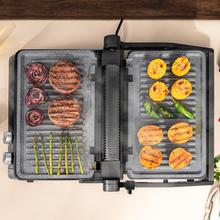 Rockn'Grill Bistro Grelha elétrica de 2400 W com sistema Smokeless que ajusta o tempo e temperatura em função de modo e o ponto de cozedura selecionados, placas amovíveis com revestimento RockStone aptas para máquina da louça e abertura 180º.