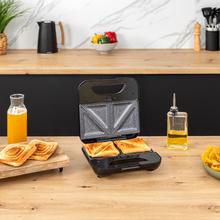 Rock’nToast Combo Sandwichera de 2 sándwiches con acabados en acero inoxidable, 800 W de potencia y 3 placas intercambiables con revestimiento antiadherente.