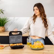 Rock'nToast Square + Appareil à sandwichs pour 2 sandwichs avec finitions en acier inoxydable, 800 W de puissance et plaques carrées avec revêtement antiadhésif.