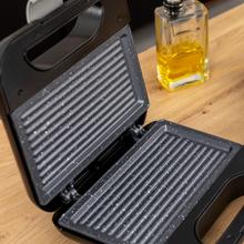 Rock'nToast Grill + Sandwichera de 2 sándwiches con acabados en acero inoxidable, 800 W de potencia y placas grill con revestimiento antiadherente.