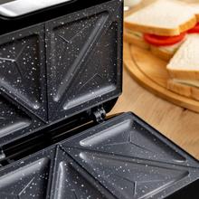 Piastra tostapane per 2 panini con finitura in acciaio inossidabile, potenza di 800 W e piastre triangolari con rivestimento antiaderente.