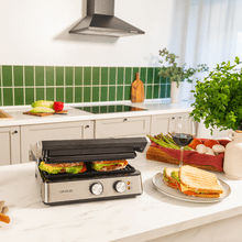Rock'nGrill Blaze Parrilla eléctrica de 2400 W que ajusta el tiempo y temperatura, posee placas con revestimiento RockStone y apertura de 180º.