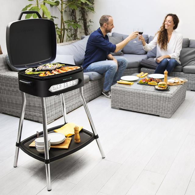 Barbecue électrique PerfectCountry BBQ. Pieds, couvercle rabattable, plateau inférieur, revêtement RockStone, plateau ramasse-graisses, surface de 43x38 cm, température réglable et 2000 W.