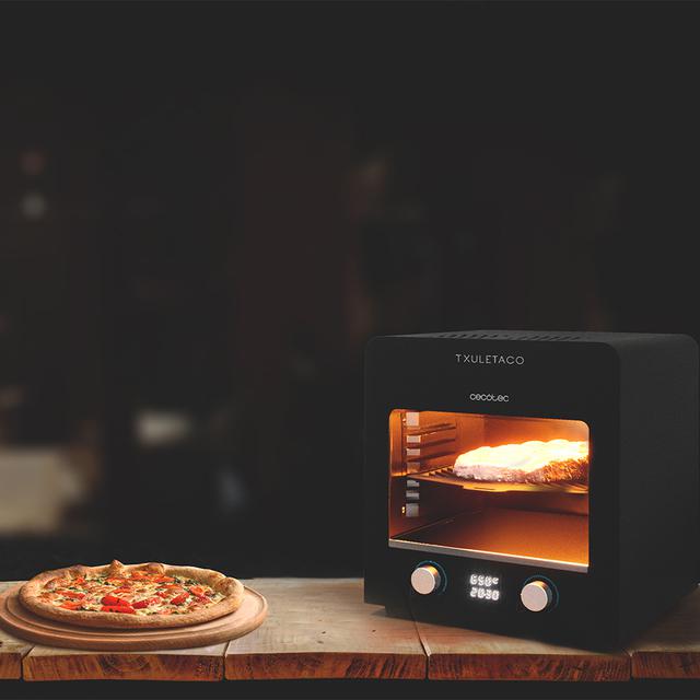 Txuletaco 8000 Inferno. Horno para asado, 2200W,Parrilla de Hierro Fundido, Piedra y Bandeja para Pizzas,2 bandejas recogegrasas, Temperatura hasta 850º, termómetro Digital de Cocina Incluido