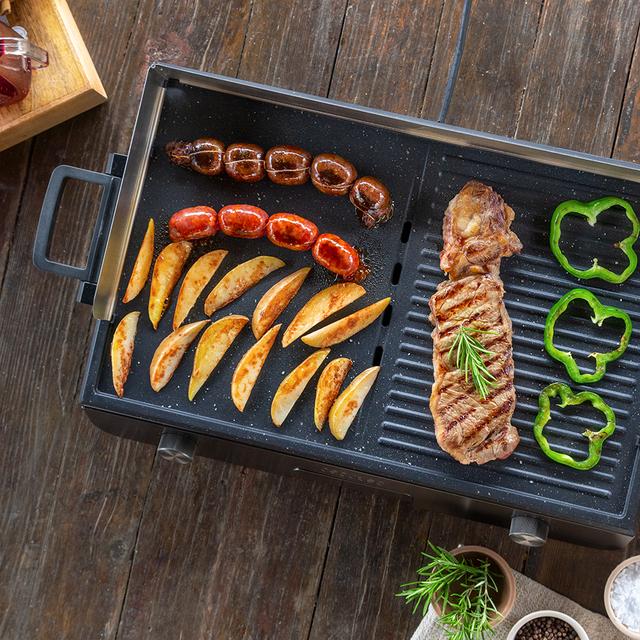 Barbecue électrique PerfectRoast 3000 Inox. 3000 W de puissance, surface de cuisson mixte avec revêtement antiadhésif Rockstone, thermostat réglable et plateau ramasse-graisses.