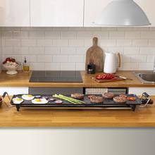 Plancha électrique Tasty&Grill 3000 RockWater XXL. 2400 W de puissance, grande surface de 90 x 22 cm, revêtement antiadhésif en pierre RockStone et thermostat réglable.