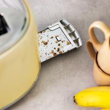 Stahltoaster mit 2 langen und breiten Schlitzen für 4 Toasts.