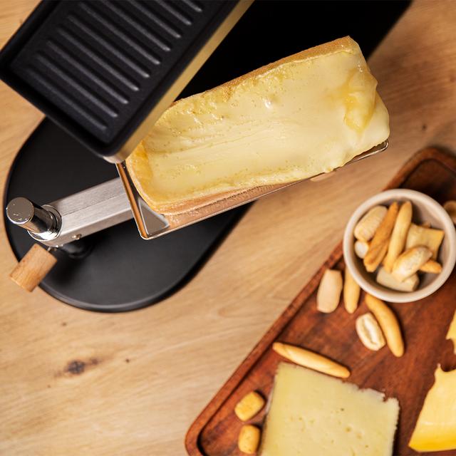 Cheese&Grill 6000 Inox Máquina para Raclette con diseño elegante en acero inoxidable, grill 600 W y parrilla superior.