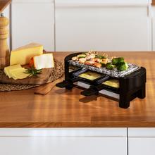 Raclette Cheese&Grill 3200 Pocket AllStone Raclettegerät für 2 Personen mit 320 W Grill. Mit Design-Struktur mit Edelstahl-Finish, Ein / Aus-Taste und Stein Grillplatte. Enthält 2 kleine antihaftbeschichtete Bratpfannen und 1 Holzspatel.