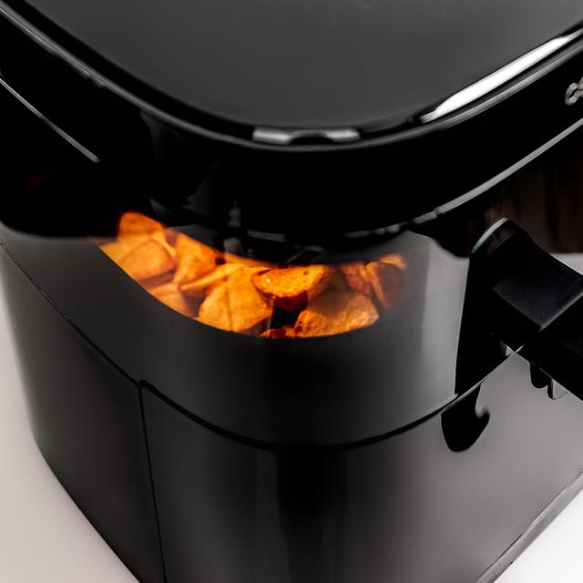 Cecofry DuoHeat 6000 Friteuse à air avec double élément chauffant pour un grillage et un saveur parfaits, capacité de 6 litres et puissance de 2200 W pour des plats sains.