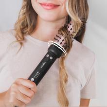 Brosse à friser Bamba InstantCare Curly AirFlow avec air chaud et plaque chauffante recouverte de céramique. Cylindre de 34 mm avec fonction rotative dans les deux sens et température réglable.