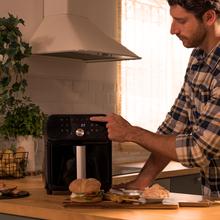 Cecofry Smokin' Duo 6000 Friteuse à air avec double résistance pour un grillage parfait de la viande, fonction Fumage, capacité de 6 litres et puissance de 2200 W pour des plats sains.