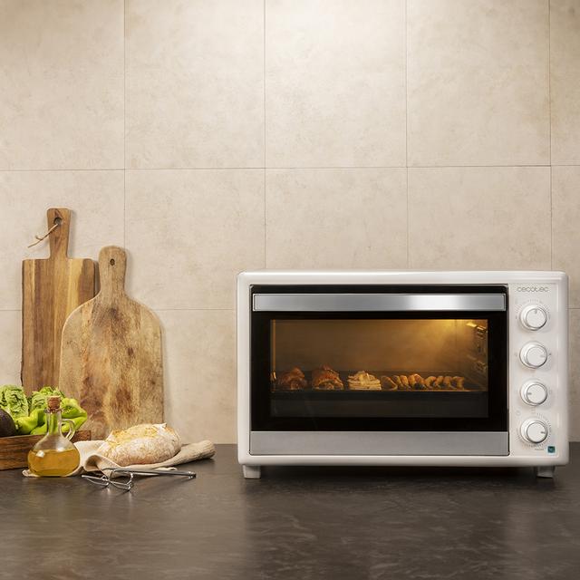 Bake&Toast 6090 White Gyro horno sobremesa con capacidad de 60 litros, 12 funciones combinables, gran potencia de 2200W y equipado con luz interior.
