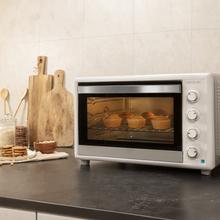 Bake&Toast 6090 White Gyro Mini-Forno com capacidade de 60 litros, 12 funções combináveis, alta potência de 2200 W e equipado com luz interior.