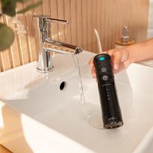 ToothCare Jet Fresh Idropulsore orale a batteria con serbatoio da 180 ml, 3 beccucci, 3 modalità e 20 giorni di autonomia (2 usi al giorno).