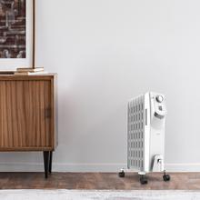 Radiateur bain d’huile Ready Warm 5750 Space 360º White avec 7 éléments, faible consommation, 1500 W, 3 niveaux de puissance, protection contre la surchauffe et le renversement, roues et 18 m² de surface couverte.