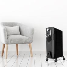 Radiateur bain d’huile Ready Warm 5820 Space 360º Black. 9 éléments, faible consommation, 2000 W, 3 niveaux de puissance, protection contre la surchauffe et le renversement, roues, 20 m²