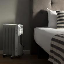 Radiateur bain d’huile ReadyWarm 9000 Space. 9 éléments, faible consommation, 2000 W, 3 niveaux de puissance, ramasse-câbles, système de sécurité, roues, 20 m² de surface couverte.