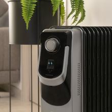 Radiateur bain d’huile ReadyWarm 11000 Space 360 Black. 11 éléments, faible consommation, 2500 W, 3 niveaux de puissance, ramasse-câbles, technologie 360, système de sécurité, 28 m²