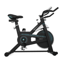 DrumFit Indoor 13000 Delfos Bicicleta indoor con volante de inercia de 13 kg, resistencia manual, manillar y sillín deportivos, pantalla LCD, sensor de frecuencia cardíaca,  calapiés y freno de emergencia.