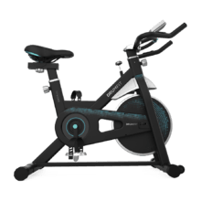 DrumFit Indoor 13000 Delfos Bicicleta indoor com volante de inércia 13 kg, resistência manual, guiador e selim desportivos, ecrã LCD, sensor do ritmo cardíaco, apoios para os pés e travão de emergência.