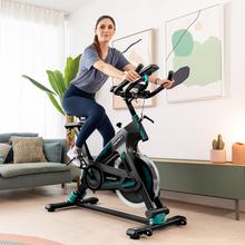 ‌DrumFit Indoor 23000 Kosmos Pro UltraFlex Bicicleta indoor com tecnologia Dynamic Provolante de inércia 23 kg, resistência manual, guiador e selim desportivos, ecrã LCD, sensor do ritmo cardíaco, apoios para os pés e travão de emergência.