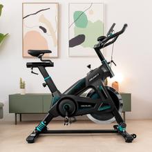 ‌DrumFit Indoor 23000 Kosmos Pro UltraFlex Bicicleta indoor com tecnologia Dynamic Provolante de inércia 23 kg, resistência manual, guiador e selim desportivos, ecrã LCD, sensor do ritmo cardíaco, apoios para os pés e travão de emergência.