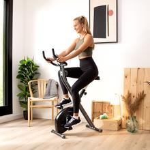 Drumfit X-Bike 3000 Neo Klappbarer Heimtrainer. LCD-Bildschirm. Schwungrad 3 kg. Variabler magnetischer Widerstand. Komfort-Sattel. Tablet-Halterung und Transportrollen.