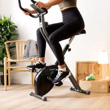 Vélo d'appartement pliable Drumfit X-Bike 3000 Neo. Écran LCD. Volant d'inertie de 3 Kg. Résistance magnétique variable. Selle confort. Support tablette et roulettes de transport.