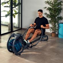 Drumfit Rower 20000 Neptuno Rudergerät mit Wasserwiderstand und 11-Liter-Behälter. APP. Horizontal verstellbarer Sattel. LCD-Bildschirm. Display-Halterung. Doppelter Lenker.