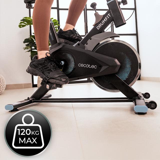 DrumFit Indoor 6000 Compact Bicicleta de ciclismo indoor compacta con volante de inercia de 6 Kg. Pantalla LCD. Soporte para dispositivos. Ruedas de transporte. Resistencia ajustable. Sillín y manillar ajustables. Peso máximo de 120 kg y altura máxima 175 cm.
