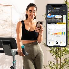 Vélo d'intérieur connecté DrumFit Indoor 10000 MagnoMotor avec système de résistance magnétique. Résistance motorisée. APP. Volant d'inertie de 10 Kg. Écran LCD. Prise en charge des appareils. Roues de transport. Pulsomètre. Poids maximum 120 kg et hauteur maximale 190 cm.