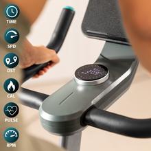 Vélo d'intérieur connecté DrumFit Indoor 10000 MagnoMotor avec système de résistance magnétique. Résistance motorisée. APP. Volant d'inertie de 10 Kg. Écran LCD. Prise en charge des appareils. Roues de transport. Pulsomètre. Poids maximum 120 kg et hauteur maximale 190 cm.