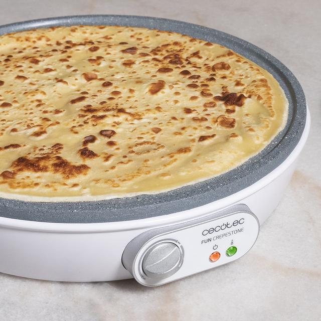 Crêpière Fun Crepestone. 1000 W, plaque réversible avec revêtement antiadhésif RockStone, thermostat réglable, répartiteur de pâte et spatule, témoin lumineux, 30,5 cm