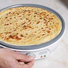 Crêpière Fun Crepestone. 1000 W, plaque réversible avec revêtement antiadhésif RockStone, thermostat réglable, répartiteur de pâte et spatule, témoin lumineux, 30,5 cm