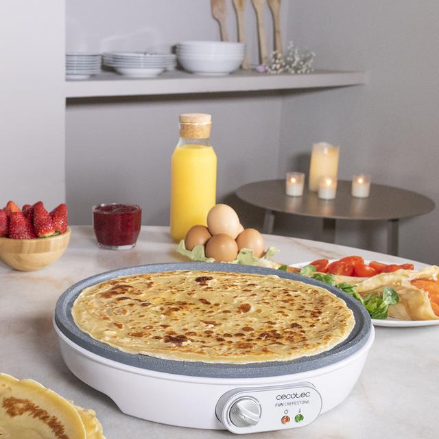 Crêpière Fun Crepestone. 1000 W, plaque réversible avec revêtement antiadhésif RockStone, thermostat réglable, répartiteur de pâte et spatule, témoin lumineux, 30,5 cm