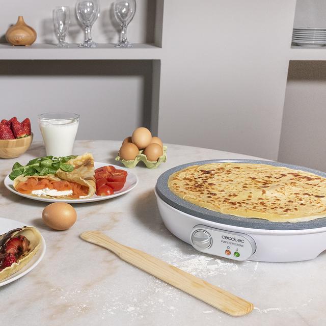 Crêpière Fun Crepestone. 1000 W, plaque réversible avec revêtement antiadhésif RockStone, thermostat réglable, répartiteur de pâte et spatule, témoin lumineux, 30,5 cm