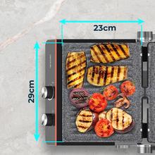 Grill électrique Rock'nGrill Blaze Neon 2200 W qui règle le temps et la température, possède des plaques amovibles avec revêtement RockStone, va au lave-vaisselle et ouverture à 180º.