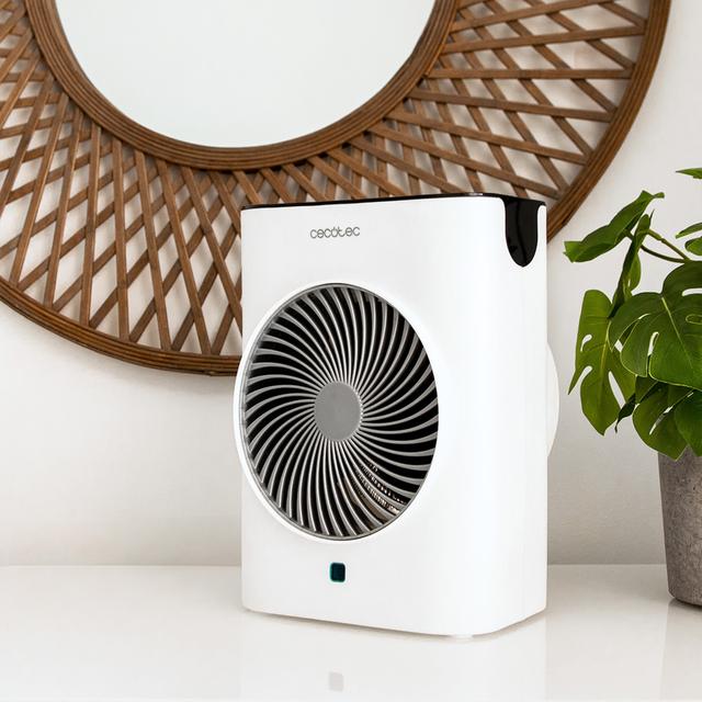 Termoventilador Cecotec ReadyWarm 2070 Max Force Smart White colocado sobre mueble