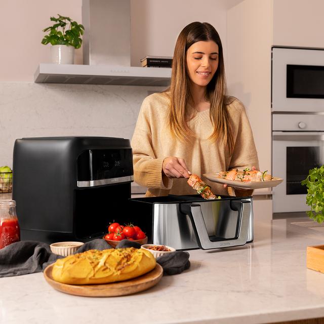 Friteuse sans huile Cecofry Dual 9000 Friteuse sans huile numérique et compacte de 9 L d'une capacité de 9 L, technologie PerfectCook et cloison mobile pour choisir entre deux paniers à double température ou devenir un seau unique.