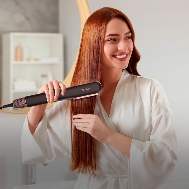 Alisador de cabelo RitualCare Air Lisse 2 em 1 Black Air com 2 cabeças: escova e concentrador. Possui 106.000 rpm com motor digital de alta tecnologia. Seque e alise os cabelos com este ferro, economizando tempo.