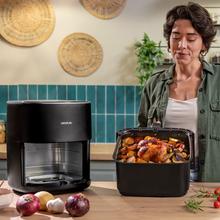 Cecofry&Grill Duoheat 6500 Friggitrice ad aria con doppia resistenza per una doratura perfetta e sapore di barbecue sulla carne, capacità di 6,5 litri e potenza di 2200 W per piatti salutari.
