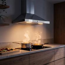 Bolero Flux PT 604400 Inox A+++ Hotte aspirante pyramidale , 60 cm, avec une puissance d'aspiration de 449,5 m³/h, classe A+++, contrôle tactile invisible, finition en acier inoxydable et façade en verre blanc, moteur DC, Hand Movement Control, fonction Booster, filtres lavables, option filtres à charbon inclus pour la recirculation.